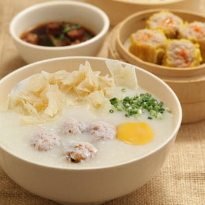 Bola-Bola Congee (comes with raw egg, fried chips and scallions)